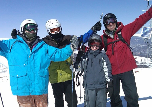The skiing in Colorado is world class. Here Ben, his two sons and a friend climb to the top of Breckenridge Mountain to enjoy some great views and some fresh powder.